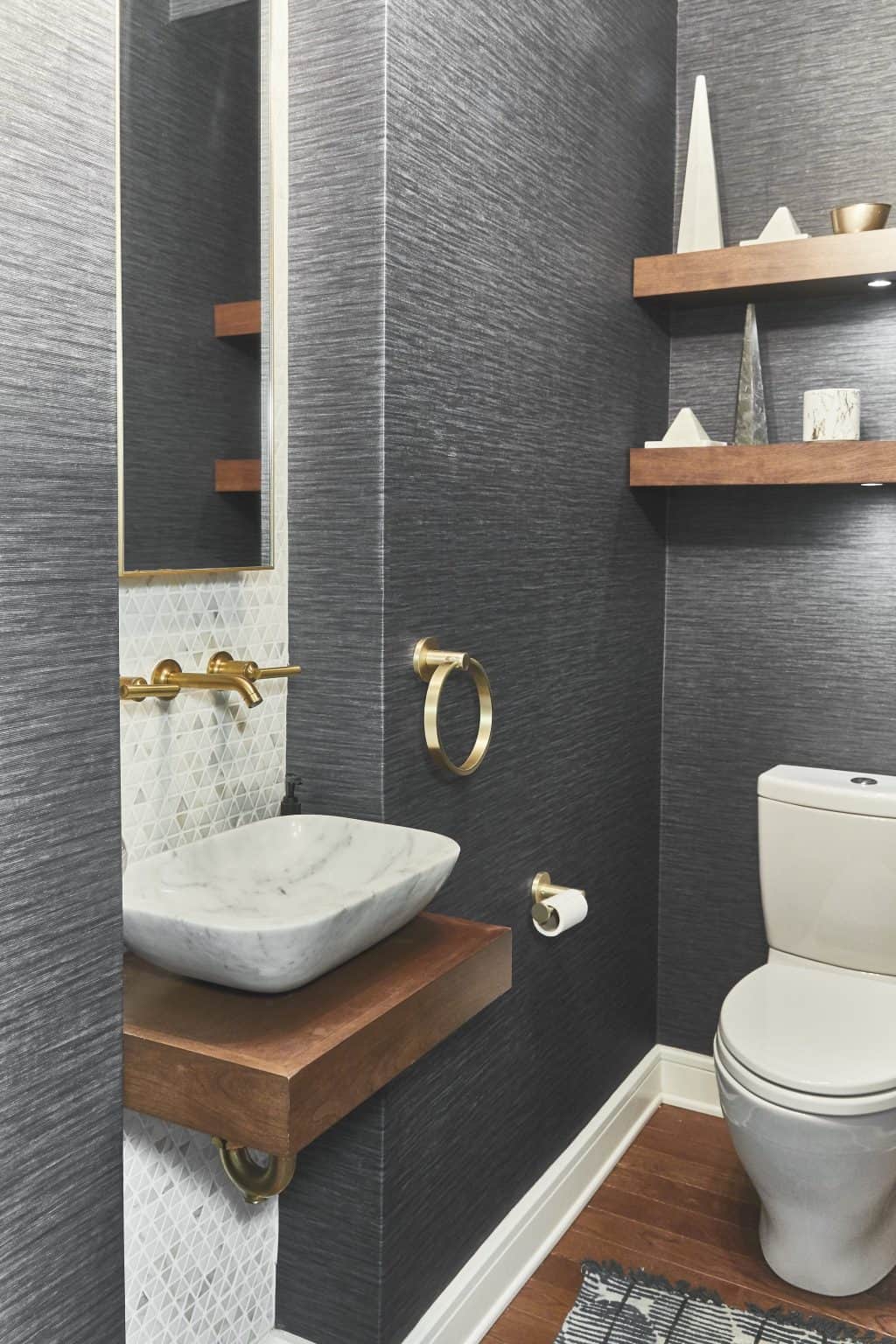 Wallpaper powder bath with sink and gold fixtures in South Miami