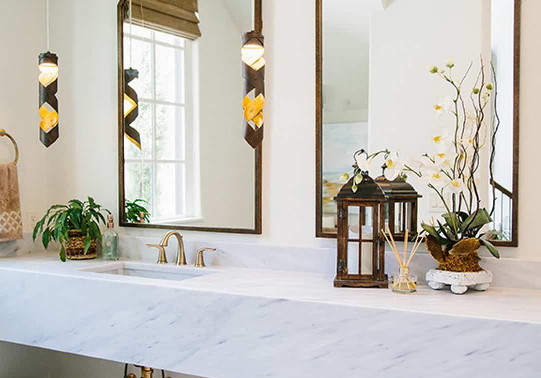 Farmhouse bathroom remodel with gold fixtures and floating sink in South Miami